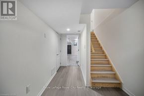 Guelph (Grange Road) apartment for rent - A hallway with a staircase leading to the second floor.