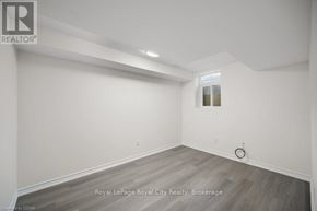 Guelph (Grange Road) apartment for rent - A room with a wooden floor and white walls.