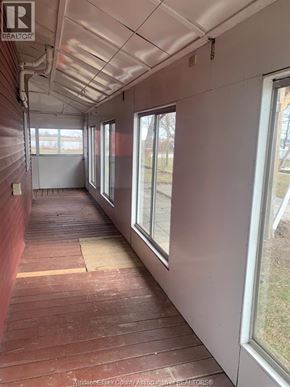 Amherstburg apartment for rent - A long hallway with windows on the side.