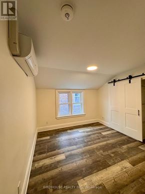 Kawartha Lakes (Lindsay) apartment for rent - A room with a window and a sliding door.