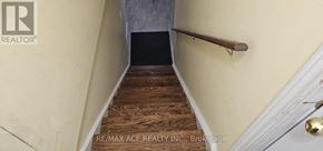 Markham (Box Grove) apartment for rent - A staircase with wooden steps and a metal handrail.