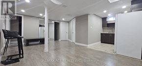 Markham (Box Grove) apartment for rent - A spacious room with a kitchenette and a dining area.