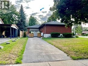 Waterloo apartment for rent - A driveway leads to a house with a garage.