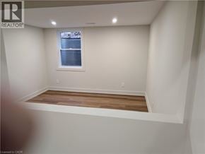 Cambridge apartment for rent - A white front loading washing machine in a laundry room.