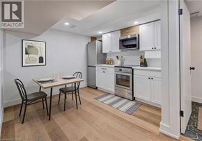 Cambridge apartment for rent - A kitchen with white cabinets and appliances.