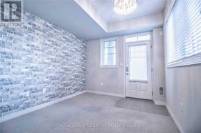 Hamilton (Stoney Creek Mountain) townhouse for rent - A room with a brick wall and a door.