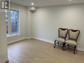 Bradford West Gwillimbury (Bradford) apartment for rent - Two chairs are placed in a room with a window.