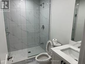 Bradford West Gwillimbury (Bradford) apartment for rent - A white toilet with a roll of toilet paper on top of it.