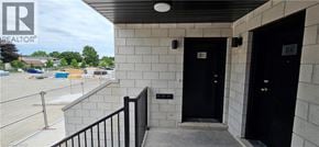 Waterloo townhouse for rent - A balcony with a black railing and two doors.