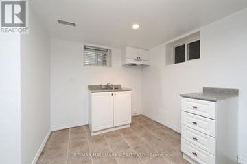 Toronto (O'connor-Parkview) apartment for rent - A kitchen with white cabinets and a countertop.