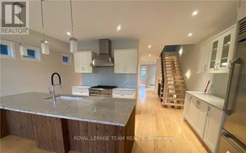 Ottawa apartment for rent - A modern kitchen with a large island in the middle.