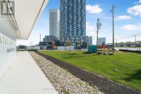 Vaughan (Concord) condo for rent - A view of a construction site with a tall building in the background.