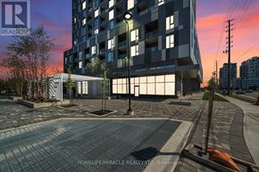 Vaughan (Concord) condo for rent - A modern building with a glass facade is depicted in the image.