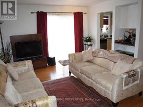Markham (Greensborough) townhouse for rent - A living room with a couch, chairs, and a table.