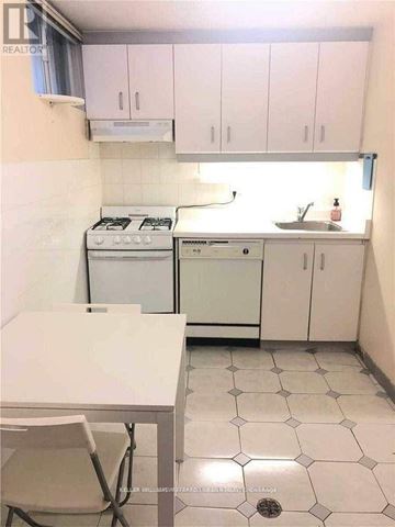 Toronto (Kensington-Chinatown) apartment for rent - A small kitchen with a table and chairs.