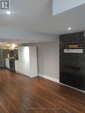 Bradford West Gwillimbury (Bradford) apartment for rent - A kitchen with white cabinets and a wooden counter top.