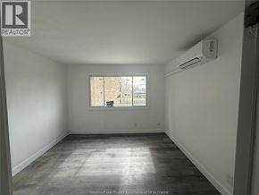 Windsor apartment for rent - A room with a window and an air conditioner unit on the wall.