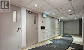 Markham (Thornhill) condo for rent - A hallway with a black mat on the floor and a door on the right.