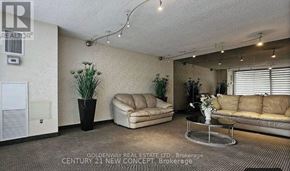 Markham (Thornhill) condo for rent - A living room with a couch, chair, and coffee table.