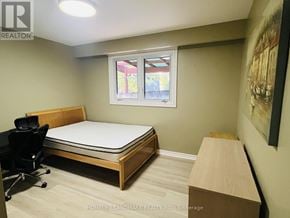 Toronto (Highland Creek) apartment for rent - A bedroom with a bed, desk, and chair.