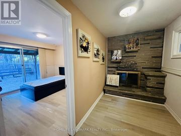 Toronto (Highland Creek) apartment for rent - A bedroom with a bed and a fireplace.