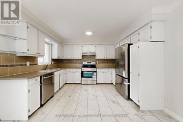Toronto (West Hill) apartment for rent - A kitchen with white cabinets and appliances.