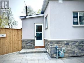 Hamilton (Hamilton Beach) apartment for rent - A small house with a white door and a stone base.