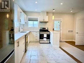 Hamilton (Hamilton Beach) apartment for rent - A kitchen with white cabinets and a marble floor.