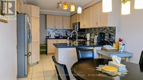 Vaughan (Sonoma Heights) apartment for rent - A kitchen with a refrigerator, table, and chairs.