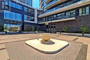 Mississauga (Hurontario) condo for rent - A courtyard with a fountain in the middle of it.