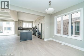 Kitchener apartment for rent - A spacious kitchen with a large island in the middle.