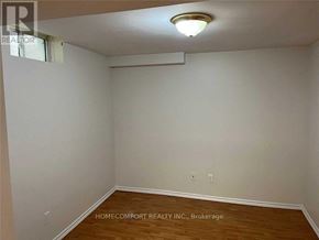 Markham (Cedarwood) apartment for rent - A room with a wooden floor and white walls.