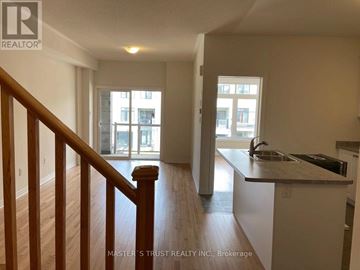 Newmarket (Woodland Hill) townhouse for rent - A well-lit kitchen with a sink and a window.