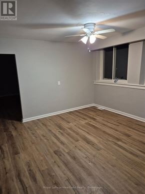 Minto multi-family for rent - A room with wooden flooring and a ceiling fan.