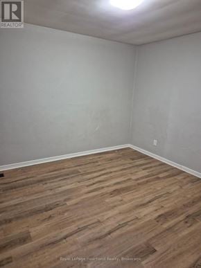 Minto multi-family for rent - A room with wooden flooring and white walls.