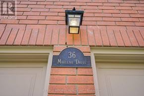 Toronto (West Hill) apartment for rent - A house number 36 with a signboard and a light on the wall.