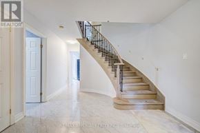 Toronto (West Hill) apartment for rent - A spacious hallway with a staircase leading to the second floor.