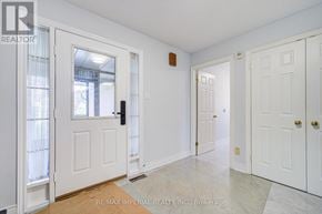 Toronto (West Hill) apartment for rent - A white door with a black handle is in a room with white walls.