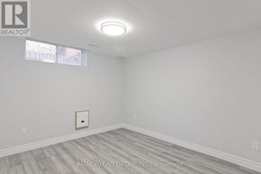 Ajax (Central East) apartment for rent - A room with a light on the ceiling and a picture on the wall.