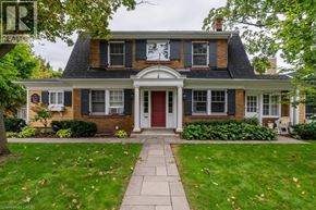 Burlington apartment for rent - A house with a red door and a sign that says REALTOR.