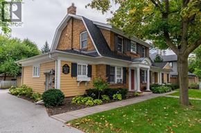 Burlington apartment for rent - A house with a brown roof and a yellow front.