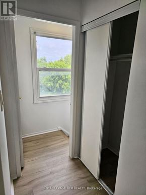 Aurora (Hills Of St Andrew) multi-family for rent - A white room with a window and a door.