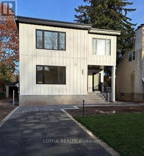 Ottawa apartment for rent - A modern house with a stone walkway in front.