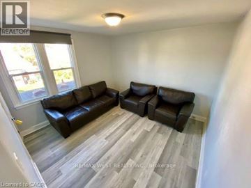 Hamilton apartment for rent - A living room with a couch and a chair.