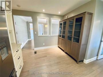 Toronto (Bayview Village) apartment for rent - A kitchen with wooden cabinets and a stainless steel refrigerator.