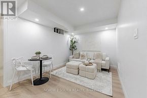 Toronto (Mount Dennis) apartment for rent - A white dining room with a round table and chairs.