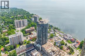 Burlington condo for rent - A cityscape with a large body of water in the background and a building under construction in the foreground.