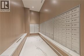 Burlington condo for rent - A row of mailboxes are lined up on a wall.