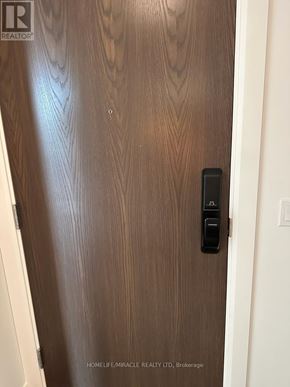 Kitchener condo for rent - A door with a handle and a lock on it.
