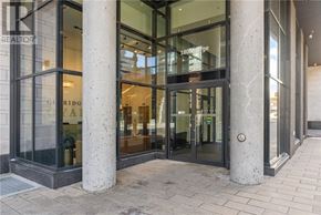 Ottawa condo for rent - The image shows a building entrance with a glass door and two large columns on either side.